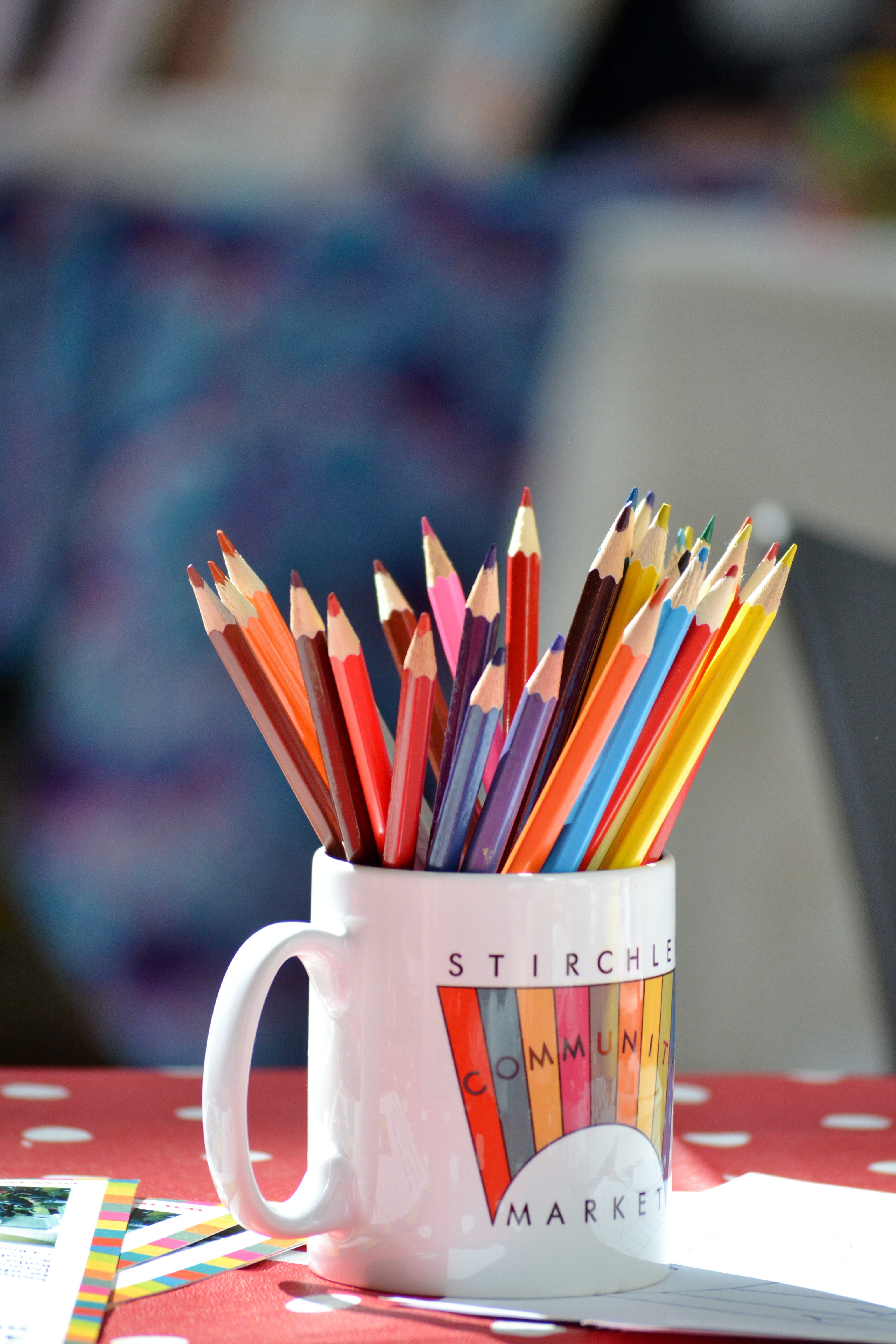 Sunshine on a Market mug full of coloured pencils