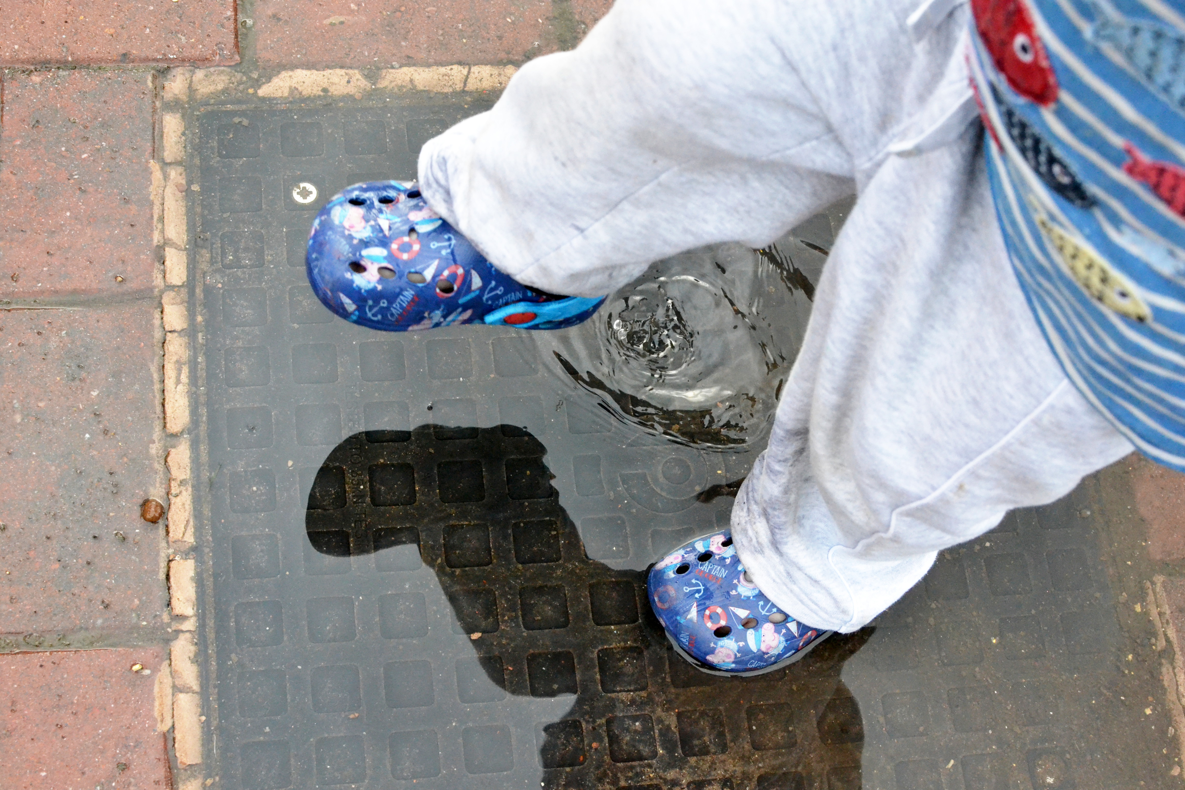 Small feet stamping in a puddle