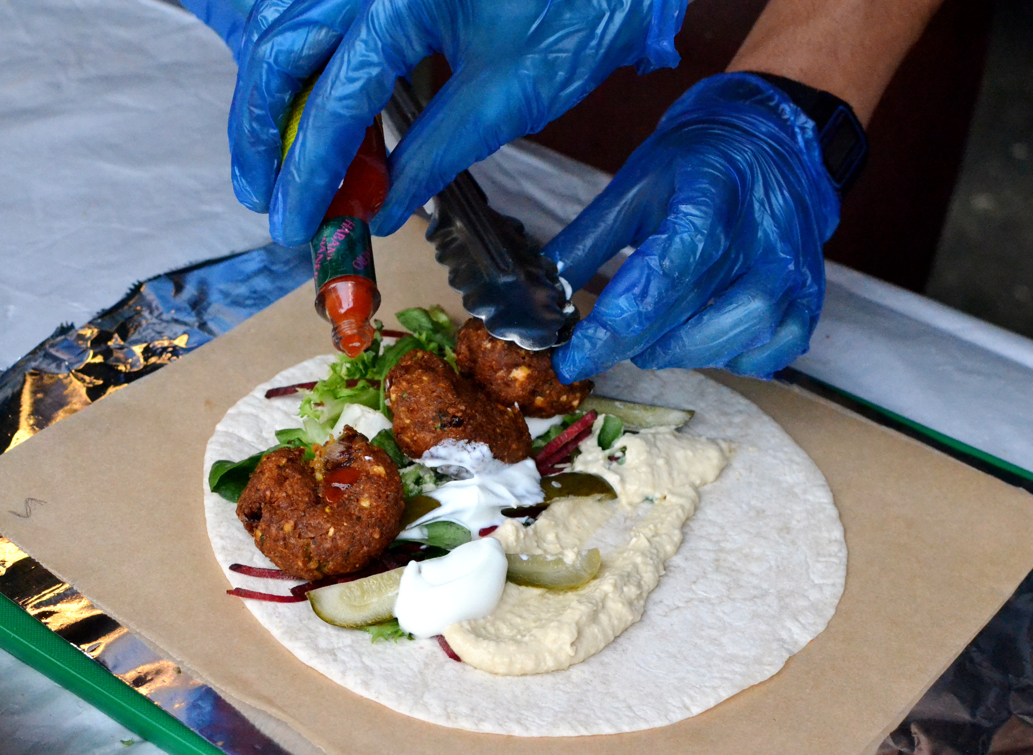 Making a falafel wrap at the Just Falafs stall