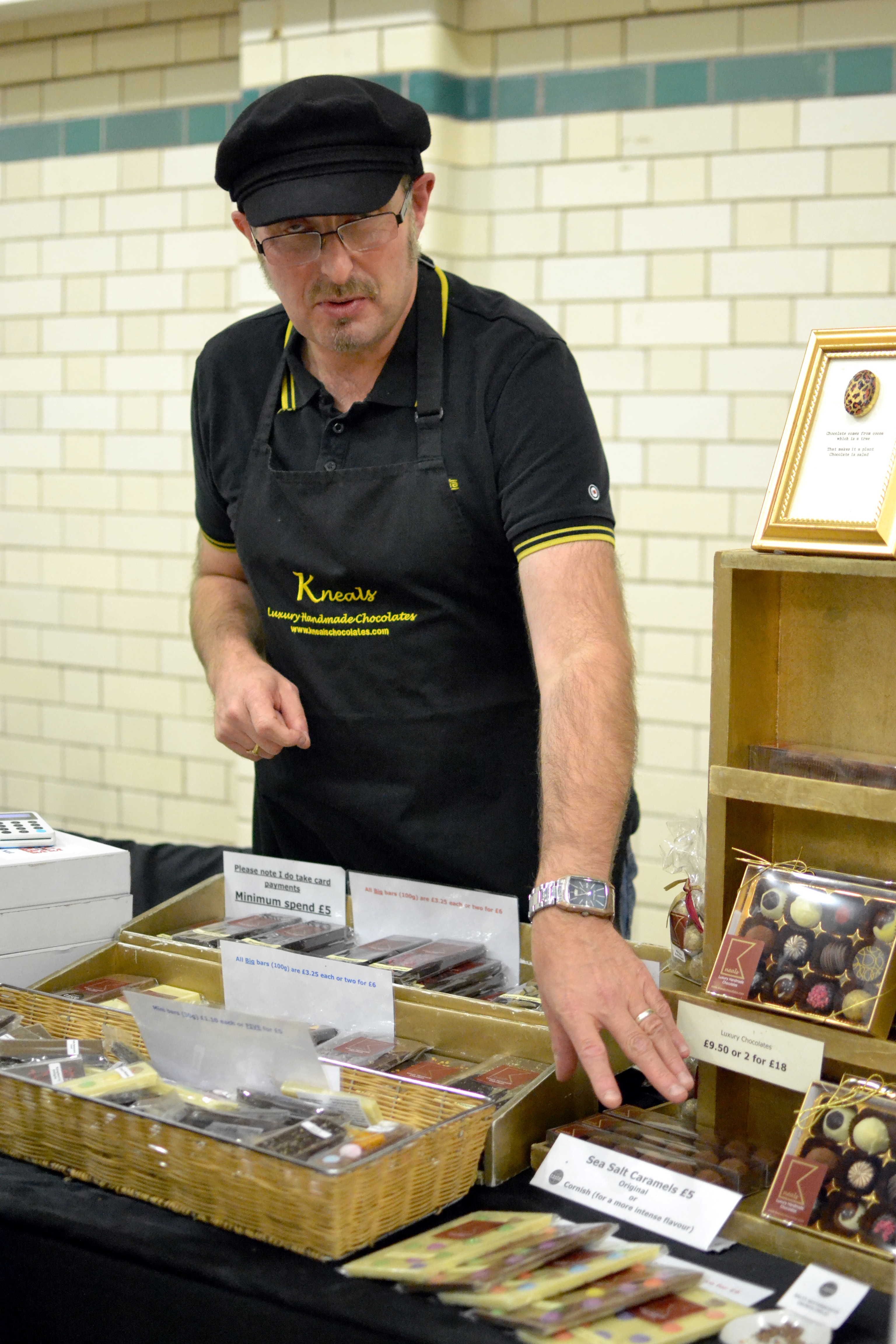 Neil with a wide range of chocolate bars and other products