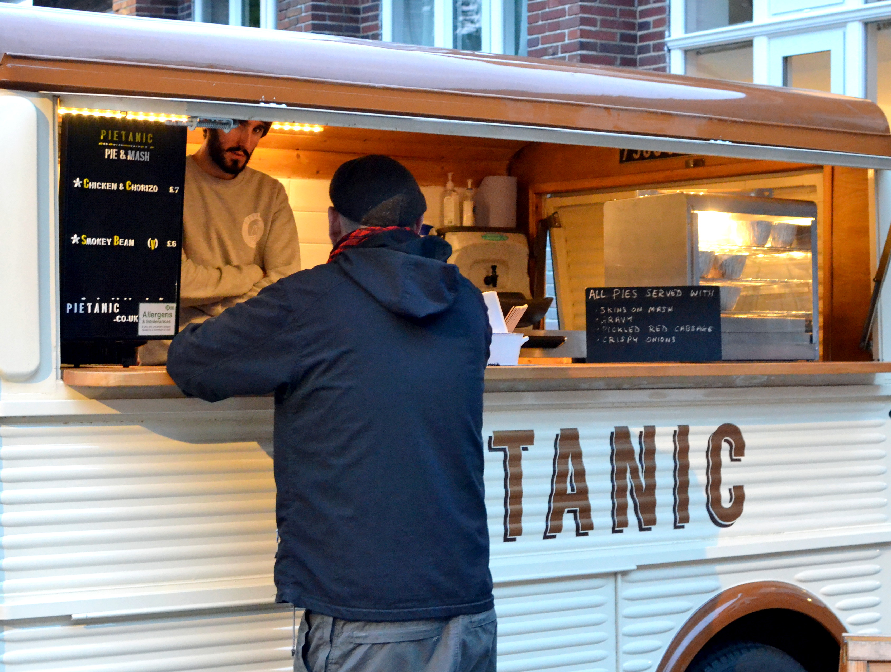 A customer outside the Pietanic van