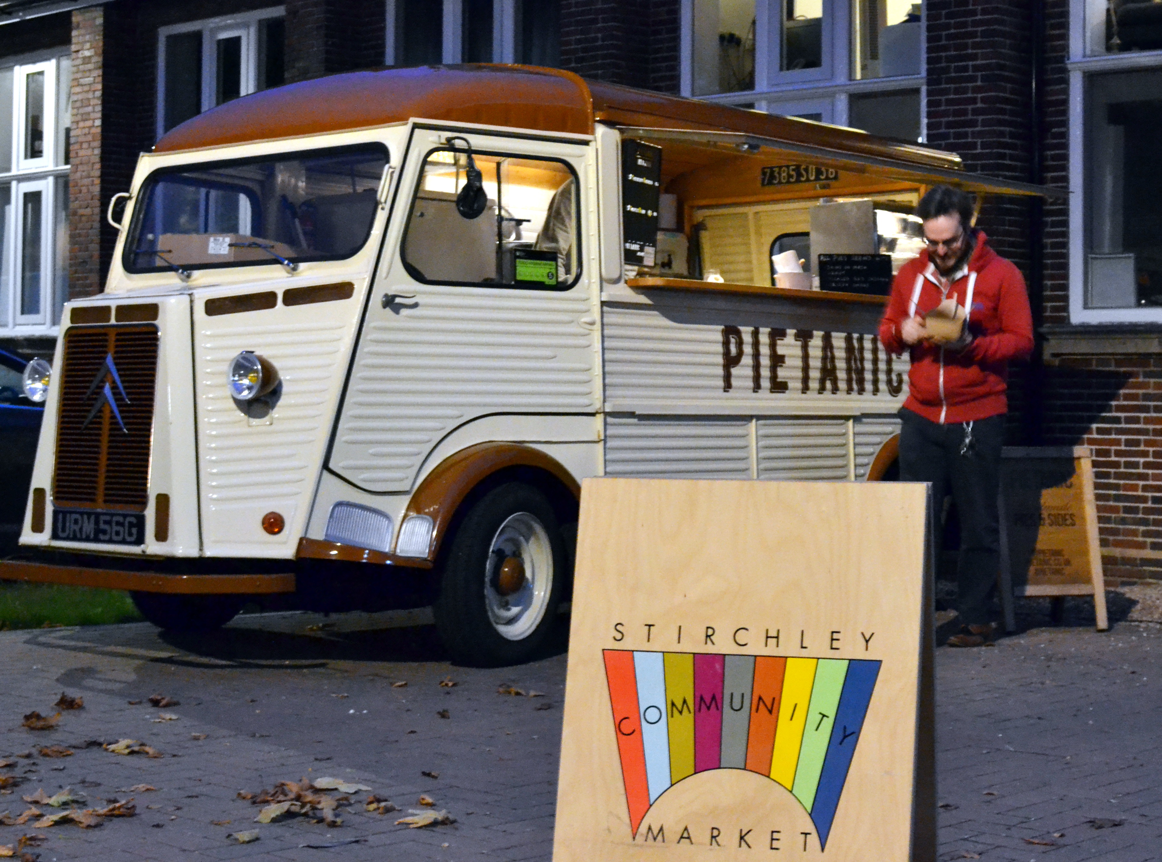 A customer with a pie outside the Pietanic van