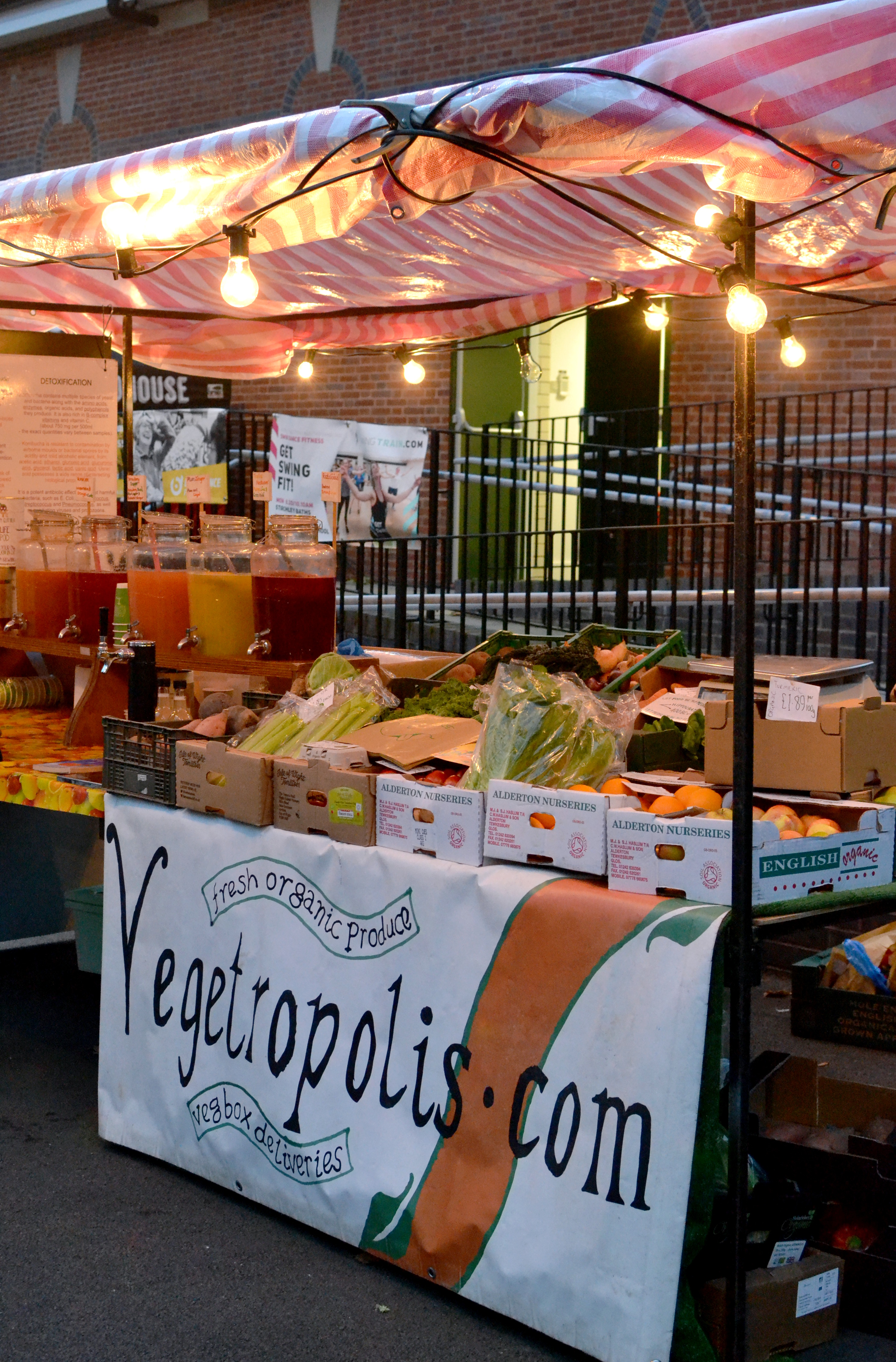 Vegetables on an outside stall decorated with lights