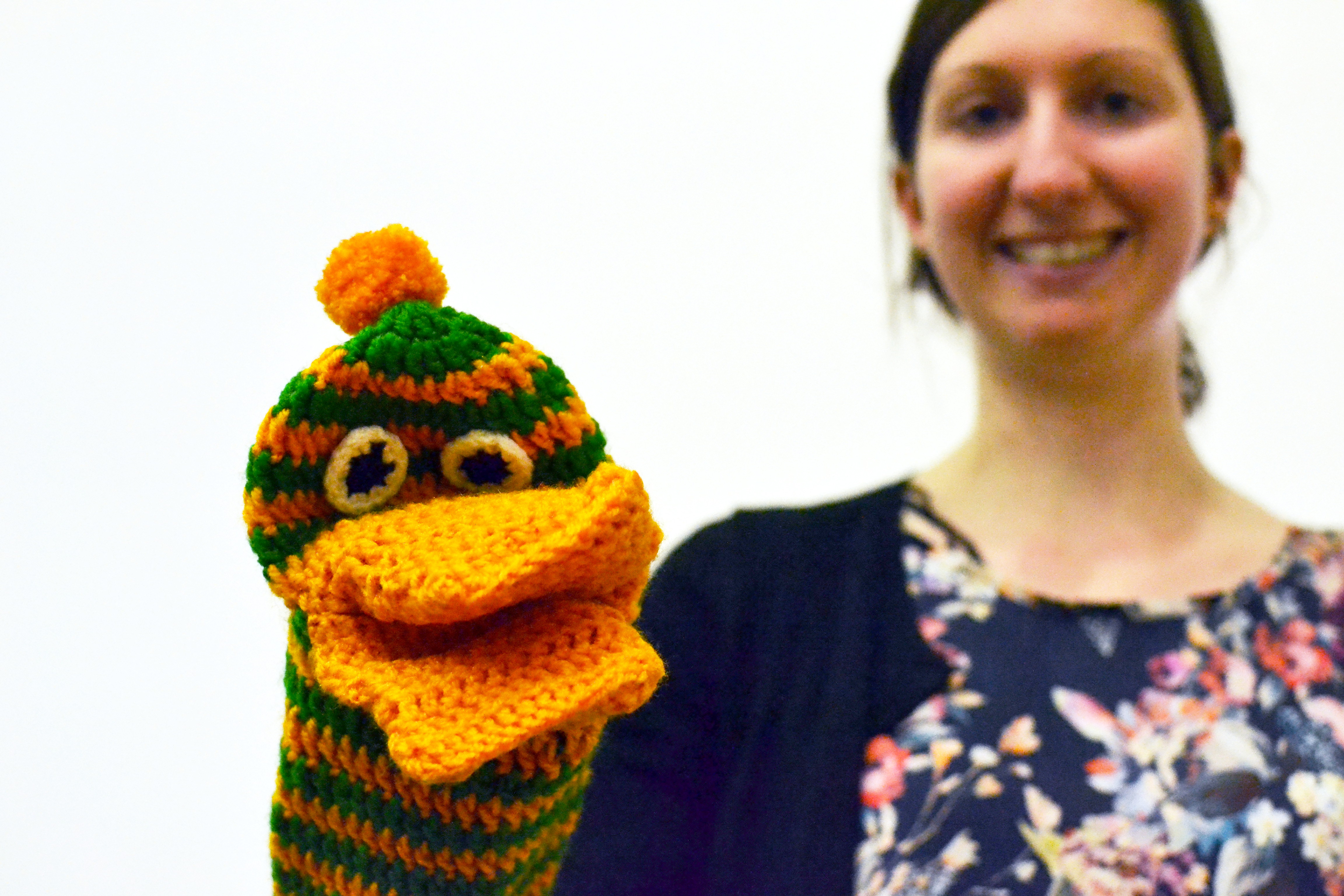 A knitted hand puppet