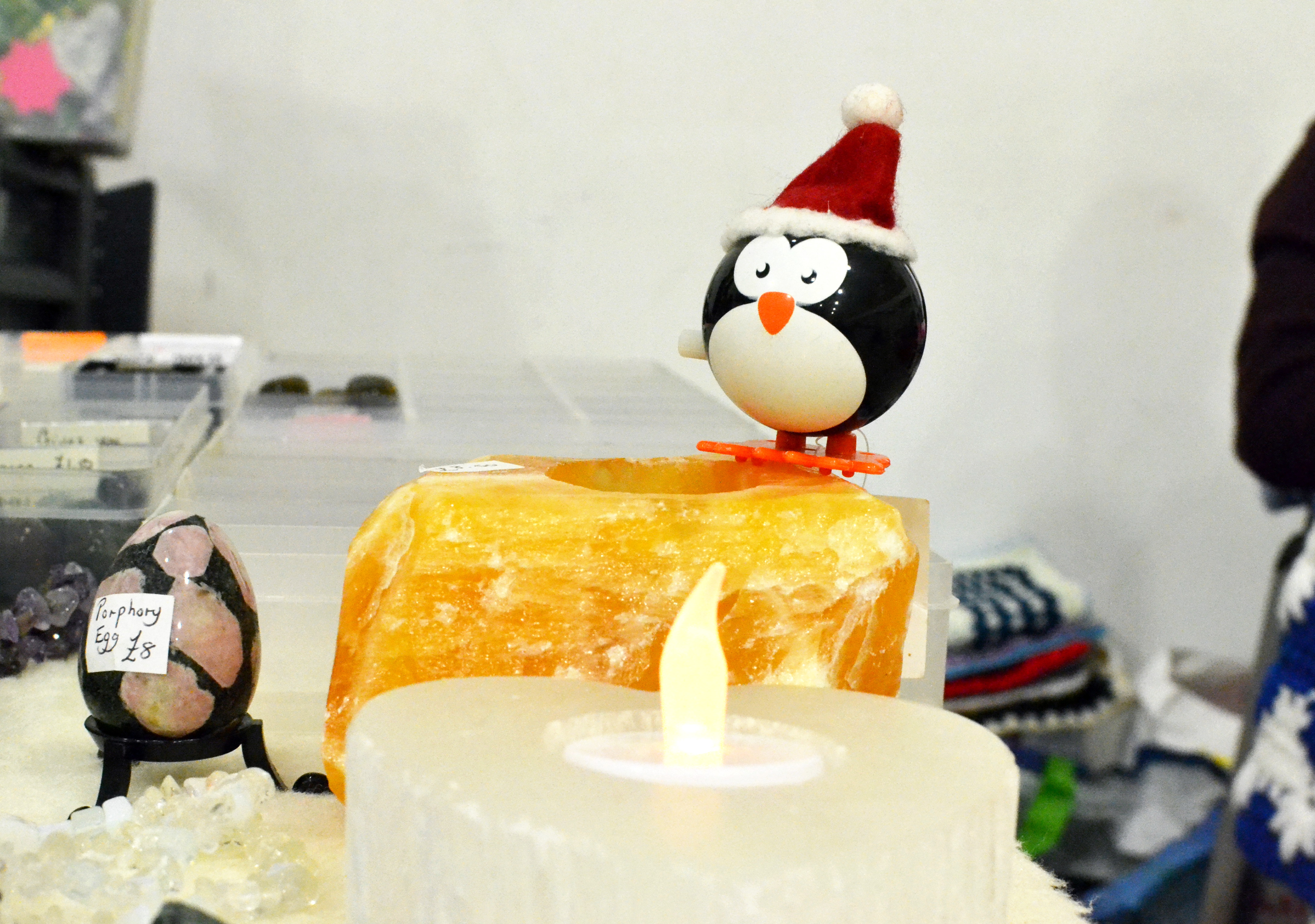 A Christmas decoration on a yellow stone