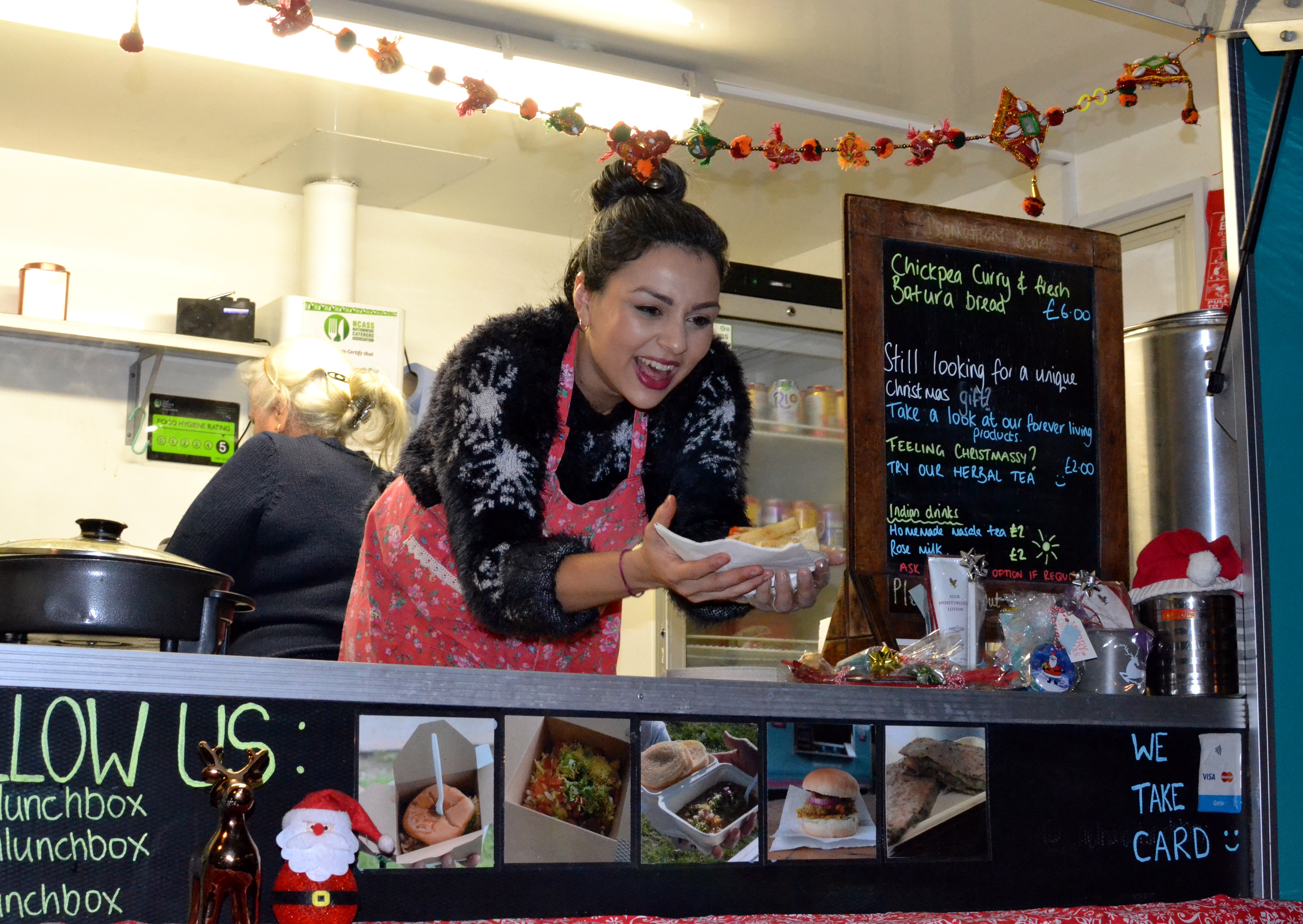 Serving meals from the Indian Lunchbox van