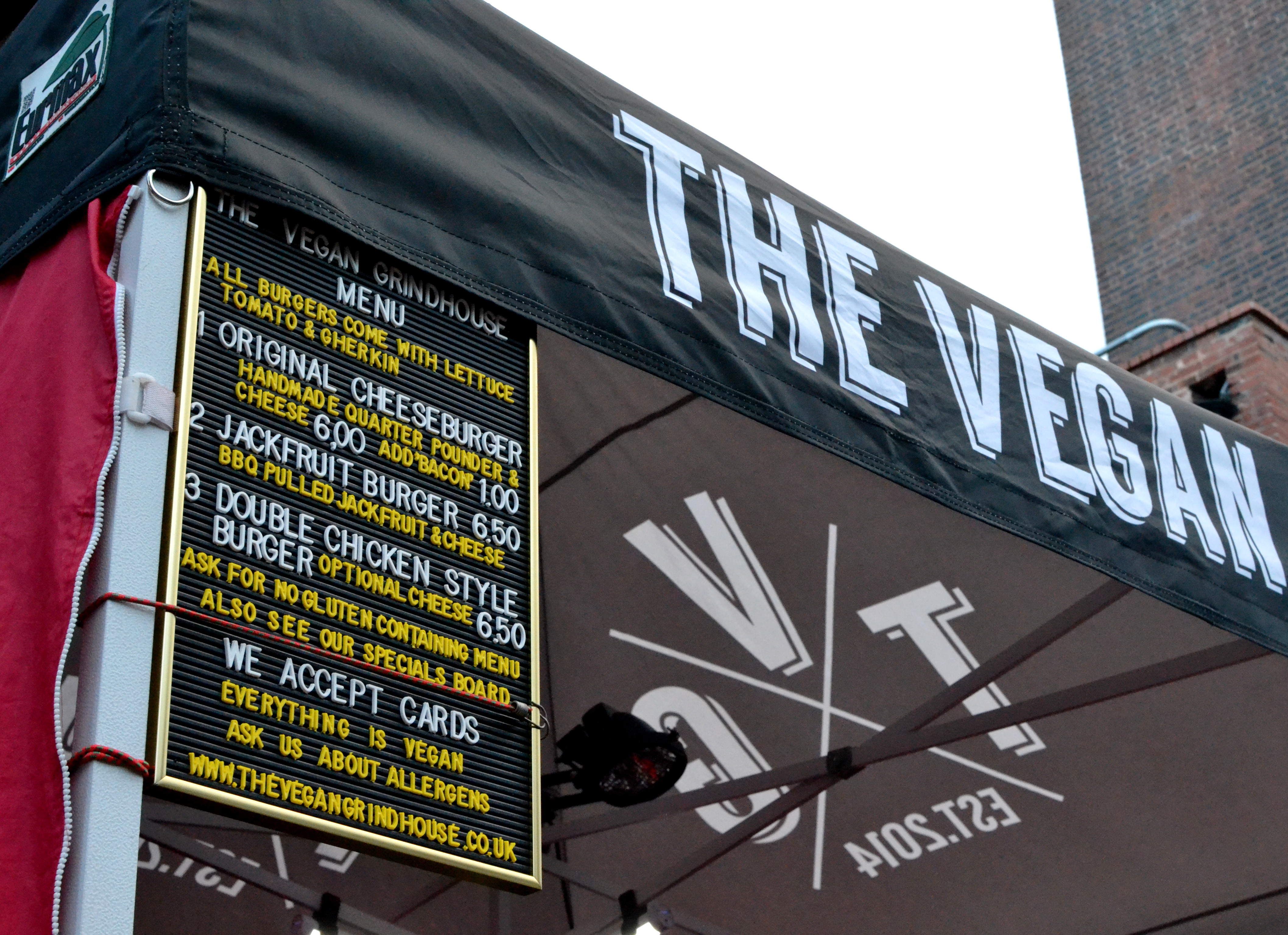 The Vegan Grindhouse stall in the shadow of the chimney of Stirchley Baths
